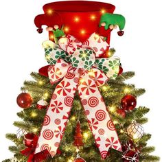 a christmas tree decorated with red, white and green bows is shown in front of a white background