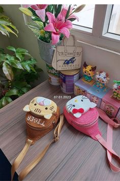 several small purses are sitting on a table