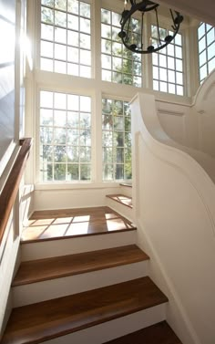 a staircase leading up to a window in a house