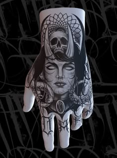 a hand with tattoos on it and a woman's face painted on the palm