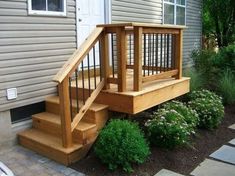 a wooden staircase leading up to a house