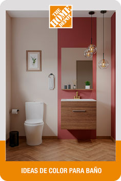 a bathroom with a toilet, sink and mirror on the wall next to a wooden floor