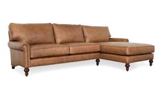 a brown leather sectional sofa with wooden legs