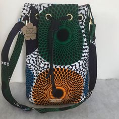 Bucket Bag Made With African Ankara Fabric. Has Inside Pocket And Fully Lined. Has Adjustable Straps Mcm Purse, Spike Bag, Lv Pochette, Kate Spade Crossbody Purse, Purple Bag, Pink Crossbody Bag, Grey Bag, African Ankara, Bucket Bags