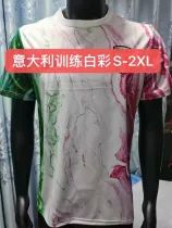 a mannequin wearing a white t - shirt with red and green designs on it