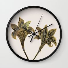 a clock with two flowers painted on it