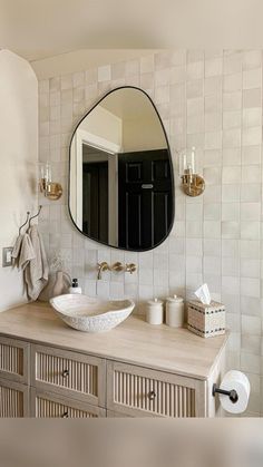 a bathroom with a sink and mirror on the wall