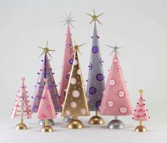 colorful christmas trees are lined up on top of each other in different colors and sizes