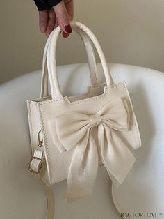 BagForLove - Compact Dual Handle Square Bag with Bow Accent Product Description Color Beige Details Bow Type Square Bag Bag Size Mini Strap Type Double Handle Pattern Type Plain Style Preppy Closure Type Zipper Composition 100% Polyurethane Material PU Leather Size Chart INCH CM Strap Length Bag Length Bag Width Bag Height Handle Height 47.2 inch 7.5 inch 3.1 inch 5.1 inch 4.9 inch Strap Length Bag Length Bag Width Bag Height Handle Height 120 cm 19 cm 8 cm 13 cm 12.5 cm Details Pictures Similar Chic Double Handle Bag For Gift, Chic Bag With Handles As Gift, Chic Shoulder Bag For Gift, Chic Shoulder Bag As Gift, Cute Cream Rectangular Shoulder Bag, Beige Bags As Gifts, Cute Rectangular Cream Shoulder Bag, Chic Cream Shoulder Bag For Gift, Chic Cream Shoulder Bag As Gift