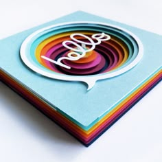 a stack of colorful cards with the word love on them and an oval cutout in the middle