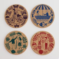 three cork coasters with different designs on them