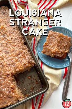 a pan filled with cake sitting on top of a blue plate next to a knife and fork