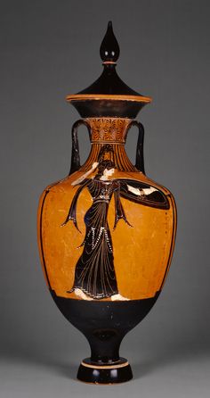 an old vase with a woman painted on it's side and lid is shown