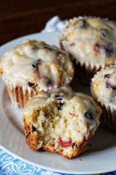 some muffins are sitting on a white plate