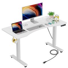 a computer desk with two monitors and a laptop on it's stand, connected to a power strip