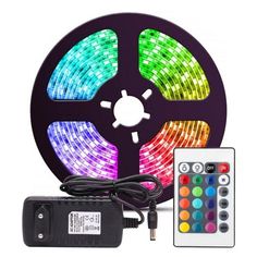 the multicolored led strip light is next to a remote control