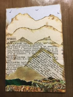 an altered collage of mountains, grass and text on paper with birds flying over them