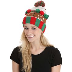 a woman wearing a christmas hat with a santa clause on it