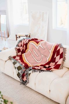 a couch with a blanket on top of it