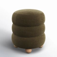 a stool made out of fabric with wooden legs and two cushions on top of it