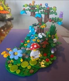 an image of a toy garden with mushrooms and flowers