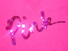 a pink shirt with the word rock written in sequins