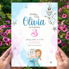 a person holding up a birthday card with an image of the character from frozen princess