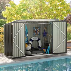 a pool side storage shed next to a swimming pool with life preservers and starfish