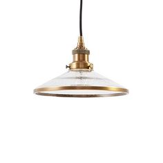 an industrial style pendant light with a white glass shade on the bottom and gold trim