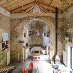 the interior of an old stone building with exposed ceilings and wood beams on the ceiling