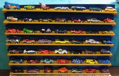 there are many toy cars on the shelves