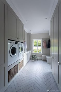 a laundry room with washer and dryer in it