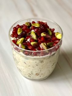 a bowl filled with fruit and nuts on top of a white table next to the words, pret's bircher muesli homemade