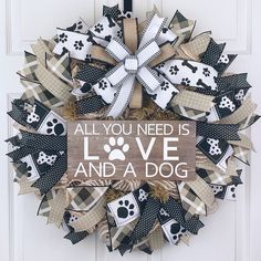 a wreath that says, all you need is love and a dog