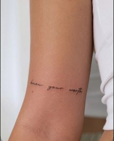 a woman's arm with the words know your worth written on her left side