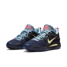 the nike zoom basketball shoe is shown in blue, yellow and white with floral accents