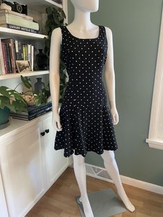 Super cute drop waist polka dot vintage 80s 90s dress washed and ready to wear! Brand is Piccolino Petites Made in the USA  Nylon Acetate blend  Size is a 10p but fits like modern S or M. See below measurements.  Dress is excellent vintage condition.  Approximate measurements taken seam to seam with garment lying flat: Bust 36" Waist 31"  Hips free Length 36" * For reference the mannequin's measurements are 35" bust, 24" waist, and 34" hips (about a modern size 4)  Dress is clamped slightly at w Fitted Retro Polka Dot Vintage Dress, Vintage Mini Dress In Polka Dot, 90s Polka Dot Dress, Polka Dot Pinup Party Dress, Polka Dot Rockabilly Dress For Retro-themed Events, Drop Waist Dress, 90s Dress, 80s Dress, Dropwaist Dress