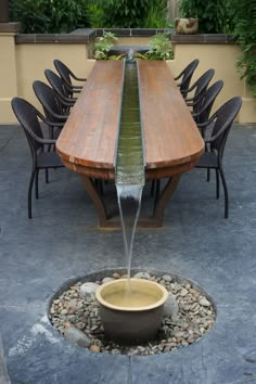 a wooden table with water coming out of it