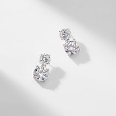 ABOUT THE PRODUCTDouble round CZ stones create an elegant drop on these modern, simple yet... Elegant Wedding Jewelry, Diamond Earrings Wedding, Wedding Earrings Studs, Round Diamond Earrings, Diamond Earrings Design, Jewelry Drawing, Bride Earrings, Cz Stud Earrings, Stunning Earrings