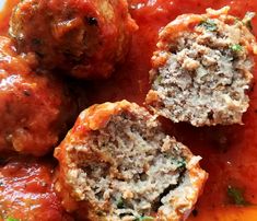 meatballs with sauce and parsley on a plate