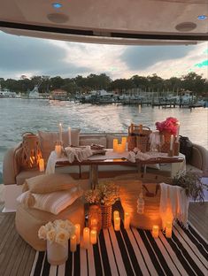 candles are lit on the deck of a boat