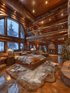 a large living room filled with furniture and a christmas tree in the middle of it