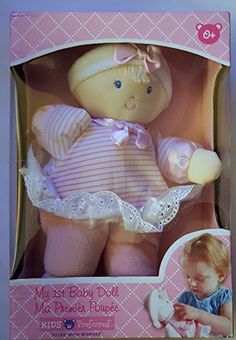 the baby doll is in its box and it's pink with white trims