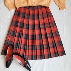 "Brand: handmade  Size: 26\" waist Color: red/green/white  Fabric Content: wool   Features:  Made in a lightweight woven wool fabric, this cute plaid skirt has box plates that run the length of the skirt. The waistband is one inch, and the closer is a zipper button combo.    Measurements:  Waist: 26in  Hip: 32in  Center Back Length: 25in    Condition: Good vintage condition with normal signs of wear, including some small, unnoticeable stains (see photos).   Care: Dry clean only  Vintage sizing varies. Please check your measurements thoroughly and ask any questions before your purchase. No returns or exchanges. Condition is noted in the product description and can be observed using the zoom feature on the photos. We are happy to send further measurements or photos upon request. Eclectriciti Fall School Uniform Lined Skirt, Preppy Skirt For School In Fall, Preppy School Skirt For Fall, Preppy Fall School Skirt, Plaid Skirt For School, Plaid Bottoms For School In Fall, Plaid Pleated Mini Skirt School Uniform, Plaid Pleated Skirt For School In Fall, Preppy Plaid Skirt For School