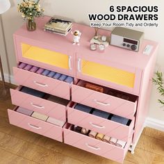 a pink dresser with six drawers filled with crafting supplies