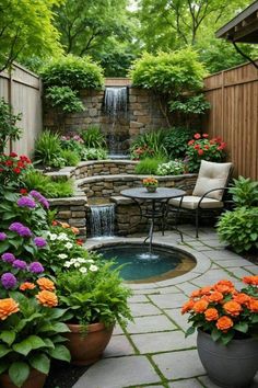 a small garden with flowers and a waterfall