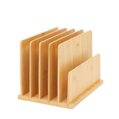 four wooden business cards in a holder on a white background