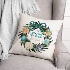 a pillow that says i'm dreaming of a warm christmas with seashells and starfish