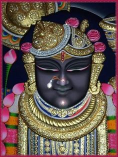 an image of the face of a god with gold and jewels on his head, surrounded by pink flowers