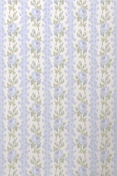 a blue and green striped wallpaper with small flowers on the bottom half of it